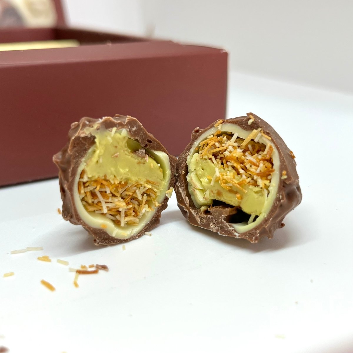 Ema Chocolate Milk and White Chocolate Truffles With Dubai Filling - Merry Christmas Box - 250g - TryAladdin