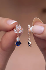 Nereze | Shuttle Zirconia Stone with Dangling Blue Solitaire Earrings - TryAladdin